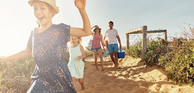 image of family on a beach vacation